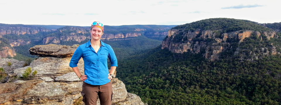 Kim standing on top of a mountain in NSW, Australia